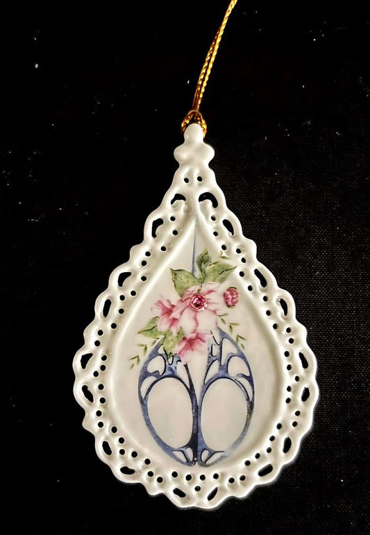 Courtly Quilter tear drop ceramic ornament with lace edging, decorative gray scissors, flowers and crystal