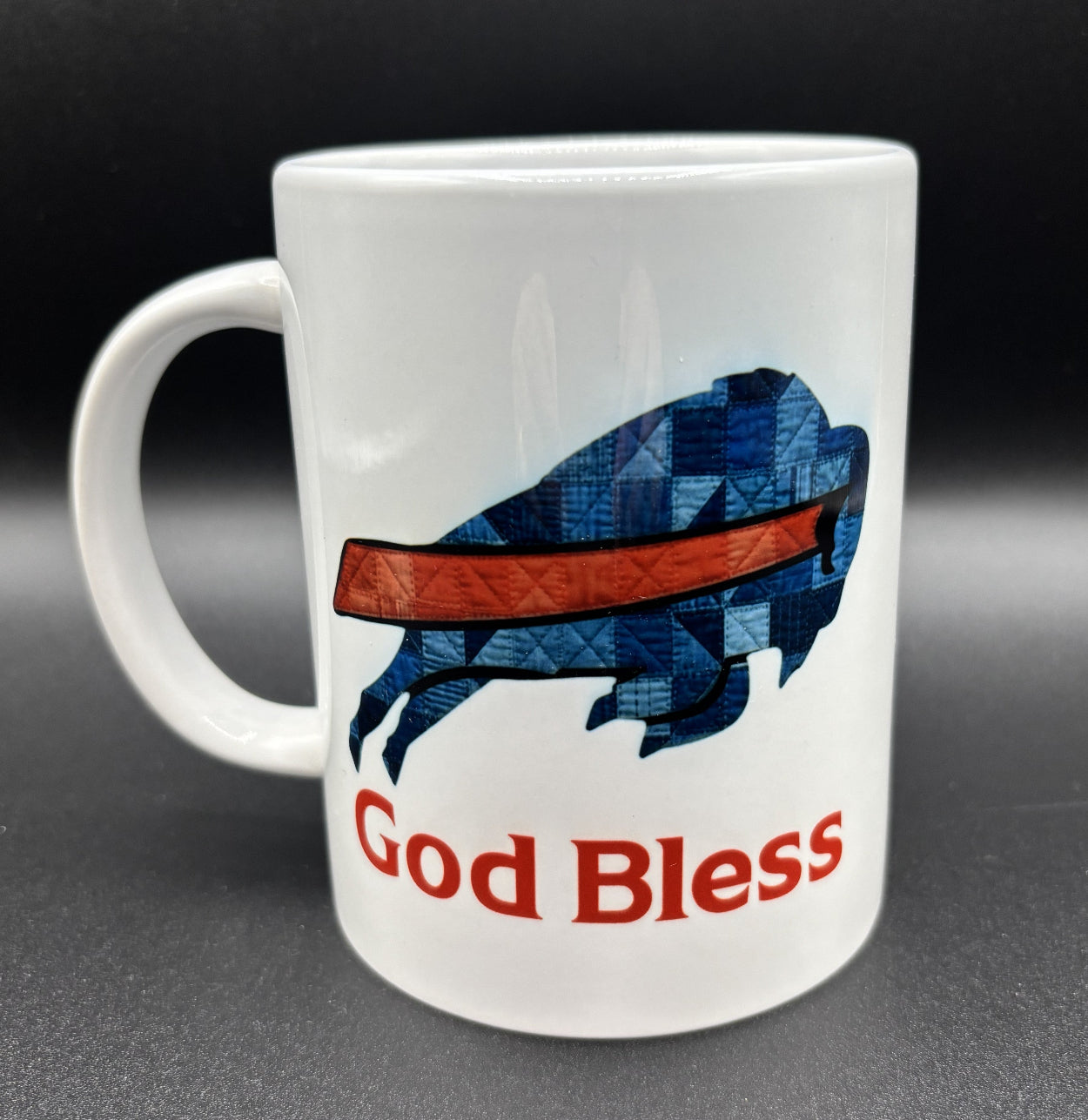 Ceramic mug with blue patchwork buffalo and 'God Bless' text, Buffalo Bils, Courtly Quilter