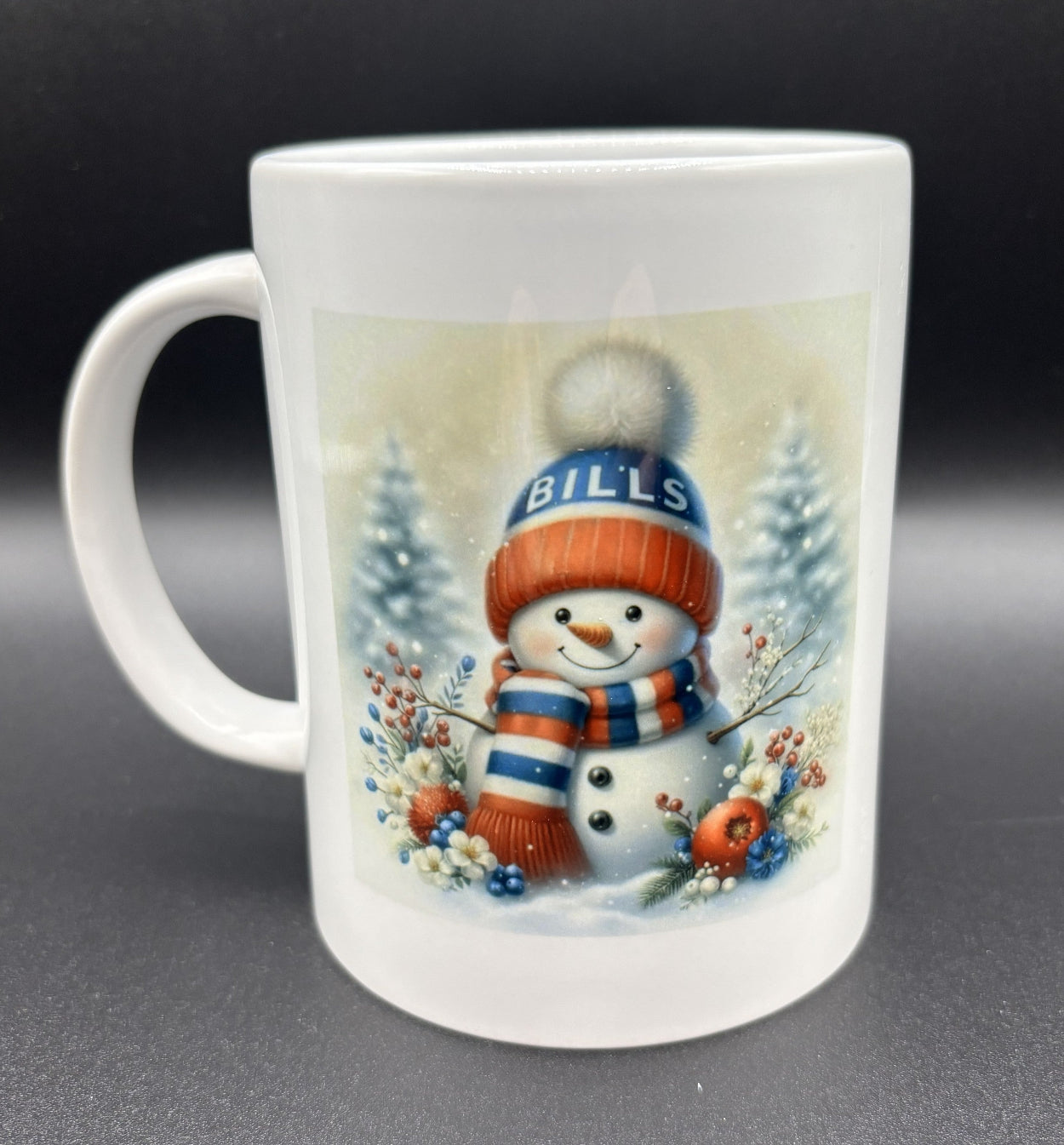 Ceramic mug with a snowman design featuring a 'Bills' hat on a snowy background, Buffalo Bills, Courtly Quilter