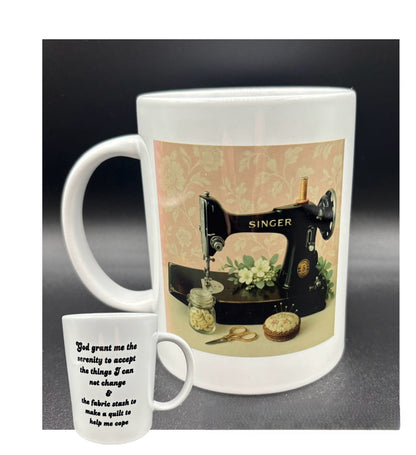 Ceramic mug with a vintage Singer featherweight sewing machine on a pink and cream floral background with text, "God grant me...." Courtly Quilter 
