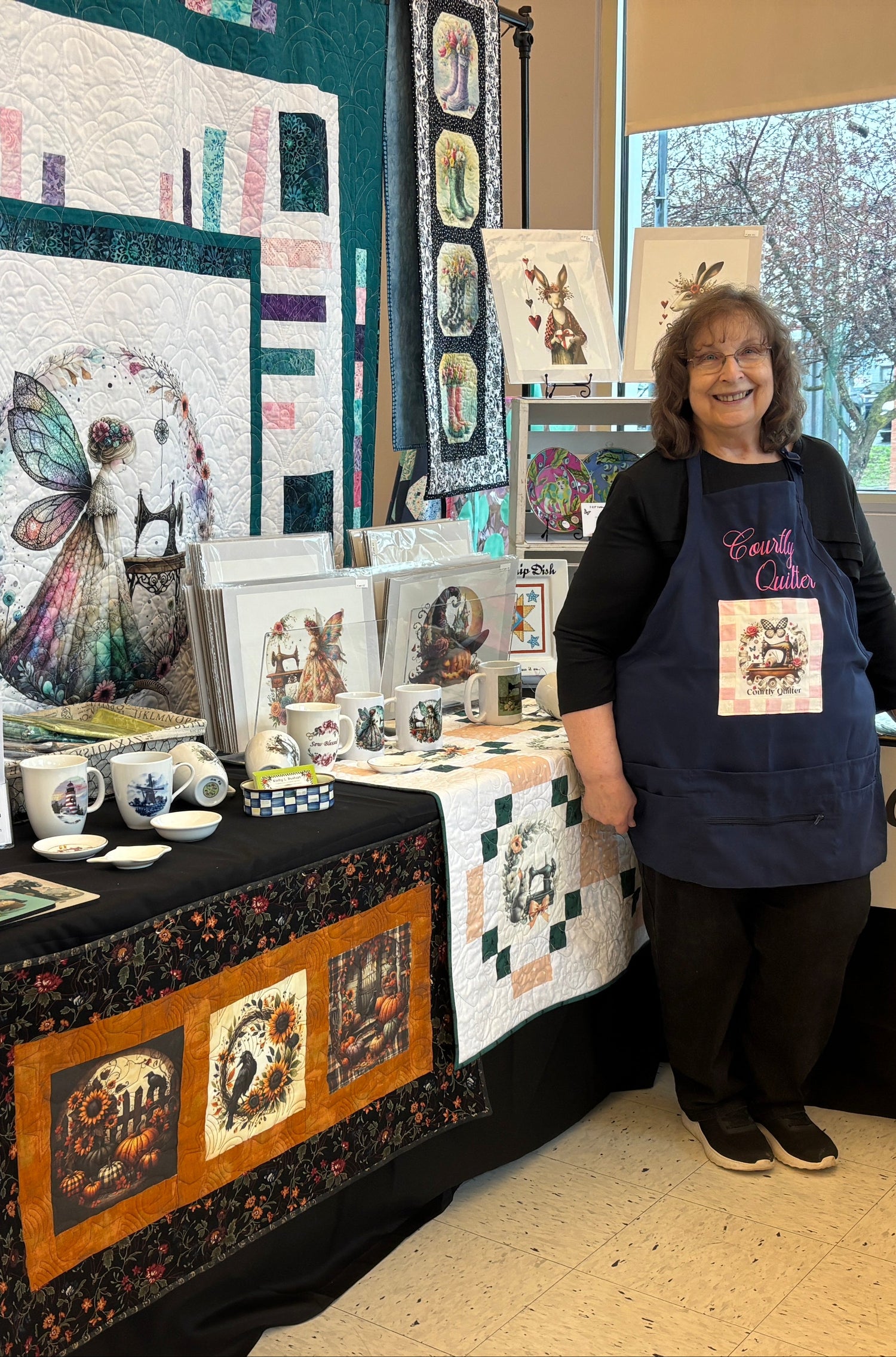 Courtly Quilter booth with Kathy at quilt show April 2026