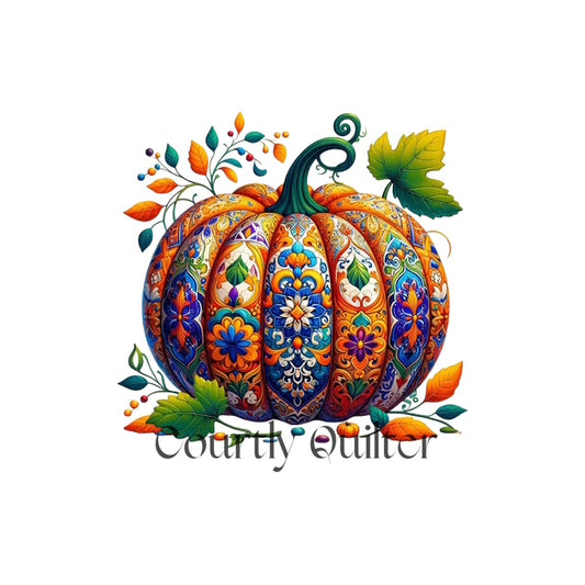 Courtly Quilter decorative pumpkin with orange/blue patterns and green leaves on a white background
