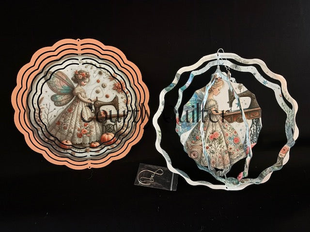 Courtly Quilter sewing fairy with vintage sewing machine on both sides of wind spinner