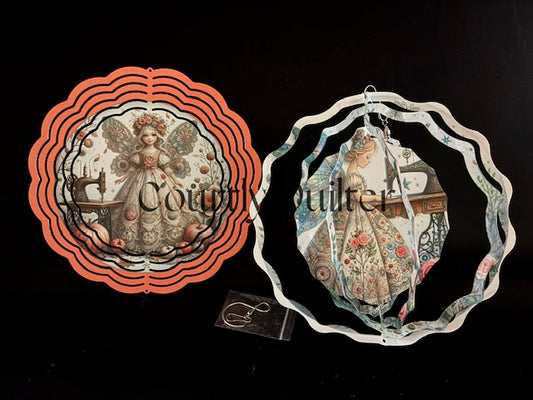 Courtly Quilter sewing fairies with vintage sewing machine on both sides of wind spinner