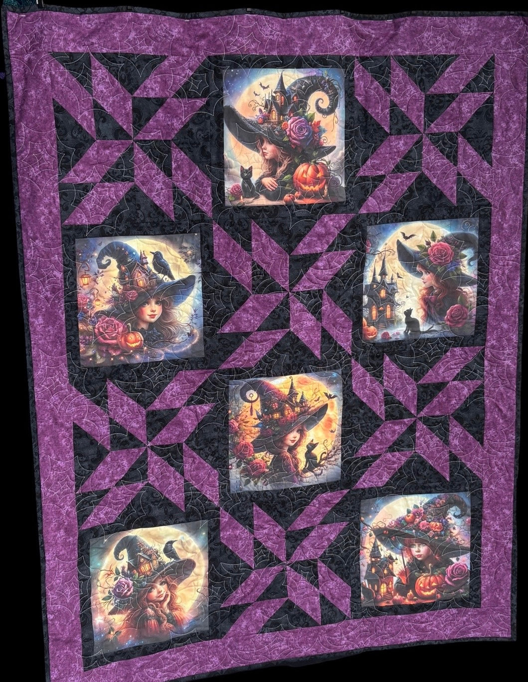 Purple and black quilt with alternating blocks with witches