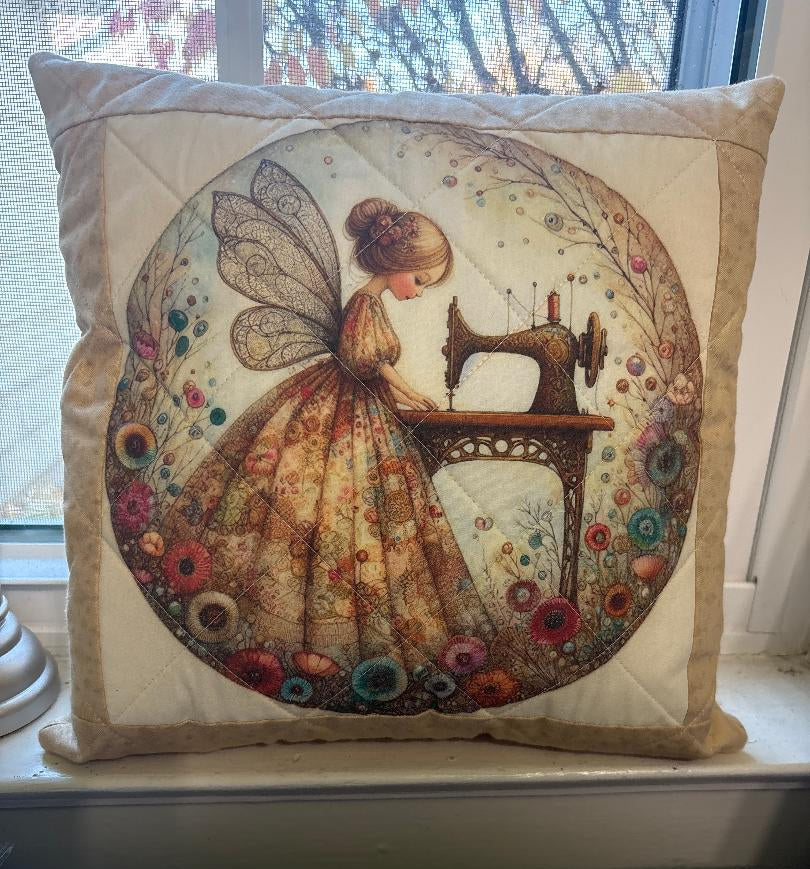Decorative pillow with a Courtly Quilter sewing fairy and sewing machine design 